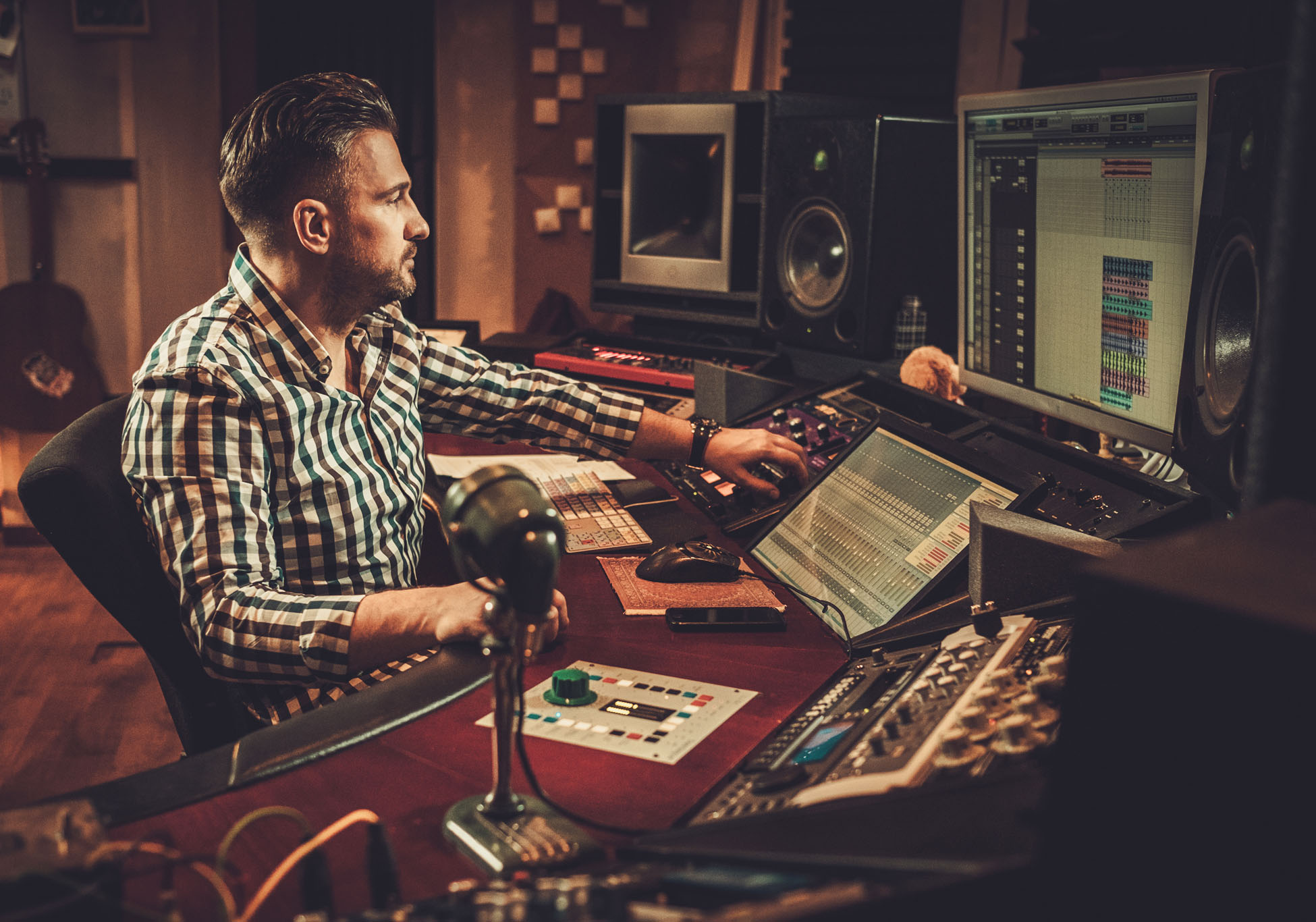 Sound engineer working in boutique recording studio